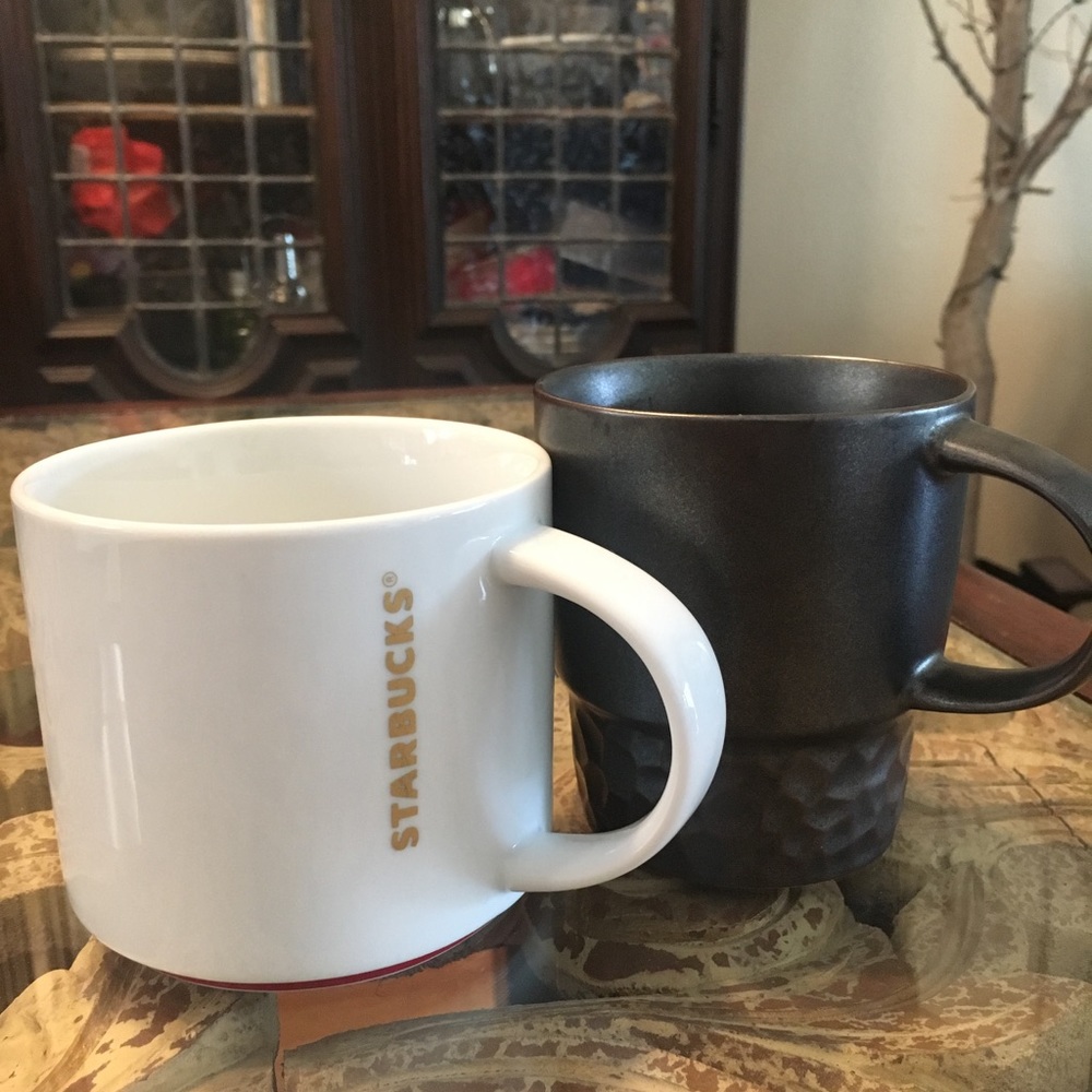 Two Starbucks coffee mugs